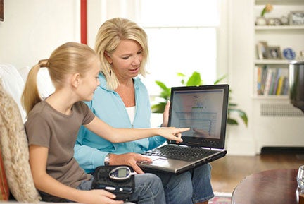 Woman and child looking at computer